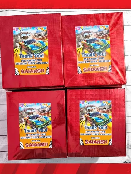 For a Supercars-themed party, the stationery sets were wrapped in red foil paper with a custom thank you sticker.