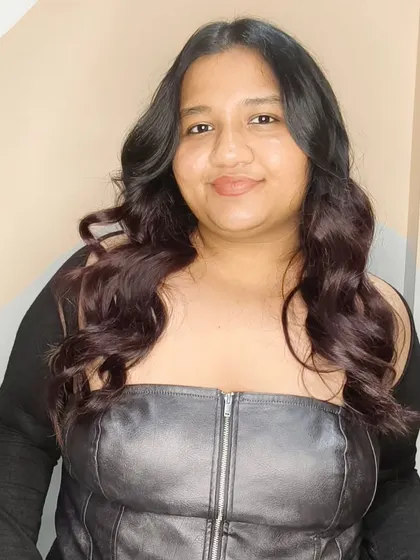 Another shot of these beautiful, soft wavy curls, showing off their texture and shine.