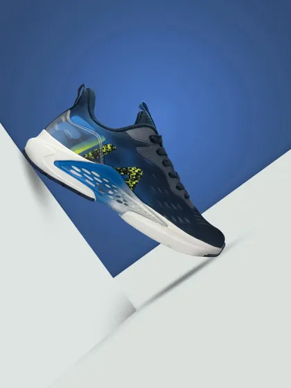 A vibrant blue Fila sneaker shot against a graphic background, creating a clean and modern look for the product.