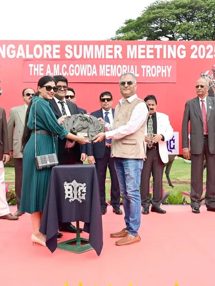 The A.M.C. Gowda Memorial Trophy is presented to the owners of Excellent Lass by Mr. Teju Yale & Mrs. Kanisha Yale.