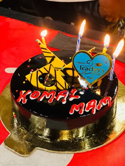 A close-up of the thoughtful Teacher's Day cake with my name on it. The little details mean so much.