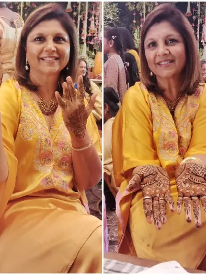 A happy guest at a wedding, showing off her simple and elegant party mehndi. I am available to do henna for all the guests at your event.