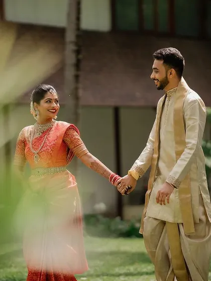 A quiet, intimate portrait framed by lush greenery. We use natural elements to create a sense of romance and tranquility in our couple's wedding photos.