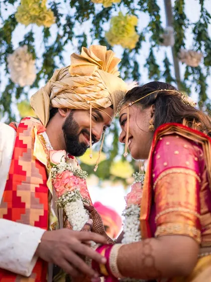 An intimate, joyful moment between Kavya and Suraj during their Varmala ceremony.
