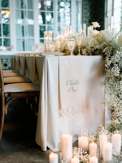 This perspective showcases the cascading floral arrangement and candlelit floor of the elegant tablescape. It’s a testament to how I layer textures and light to build a truly immersive and luxurious atmosphere.