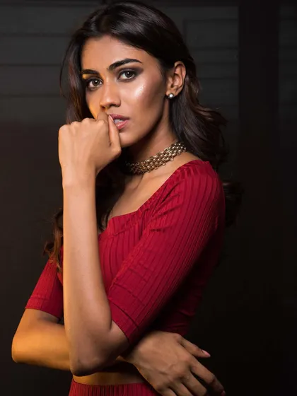A Christmas-themed shoot with Apeksha Porwal. I styled her in a chic red coordinated set with a choker, using moody lighting to create an intimate and sophisticated portrait.