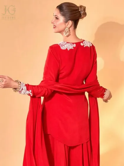 A back view showcasing the intricate details of the outfit, perfectly accented by our timeless Polki earrings and bracelets.