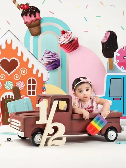 This little one is driving her truck through a land of sweets.