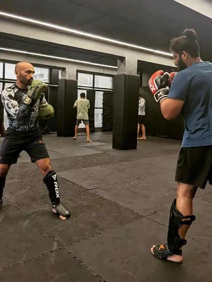 A striking drill in progress. One fighter works on his defense while the other practices combinations. This is how we sharpen our tools and support each other's growth.