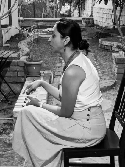 A quiet moment of reflection during a storytelling session. Telling stories to adults is a different kind of energy, often more introspective and focused on shared human experiences.
