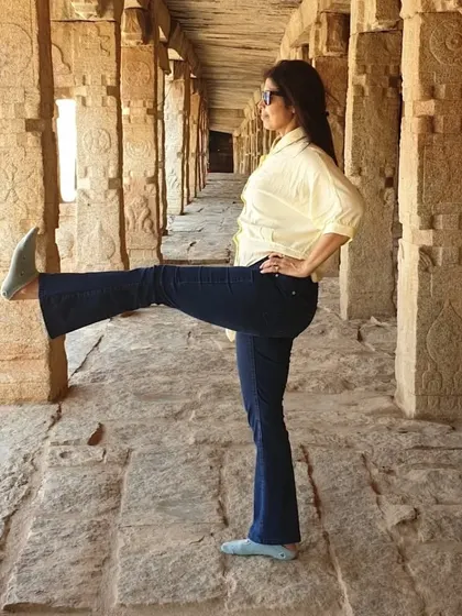 Yoga is a tool for focus. Here, I am practicing a standing leg raise amidst the ancient pillars of Hampi, showing that you can find your center anywhere.