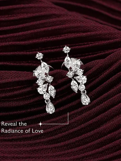 Reveal the radiance of love. Adorn yourself with my customizable diamond leaf earrings, where elegance meets a personal touch. The cascading design is tailored to your unique style, because love deserves nothing less than brilliance.