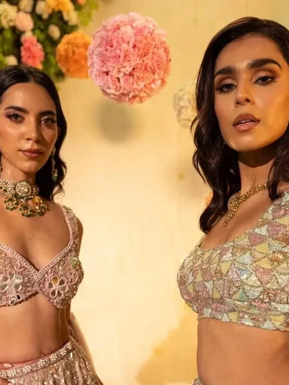 A close-up on two of the models, showing the different blouse designs and jewellery pairings.