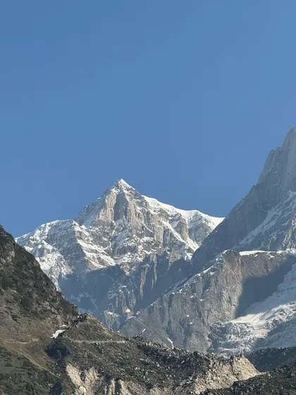 A breathtaking view of the snow-capped Himalayan peaks. This is the raw, unfiltered beauty that awaits you on our treks, a powerful reminder of nature's grandeur and the reason we feel the pull of the mountains.