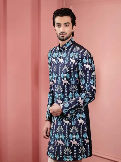 This pose highlights the unique pattern of the Indo-Western jacket. The mix of blues and whites creates a fresh and stylish look for any occasion.