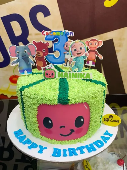 A 2.5kg Cocomelon cake with a unique textured green frosting and character toppers.
