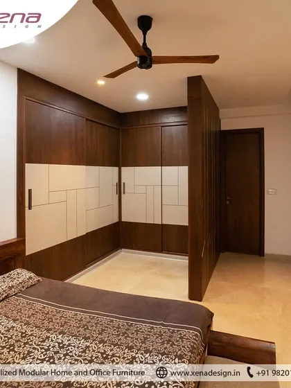 A master bedroom featuring a walk-in closet created with a clever wardrobe partition. The dark wood and white laminate combination gives it a timeless appeal.