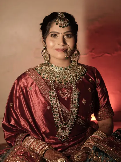 A portrait of elegance. This bride's complete look, from the makeup and hair to the stunning layered necklaces, came together so beautifully.