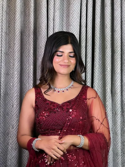 The smokey eye detail for this glamorous look. I used deep tones with a touch of shimmer on the lid to create a sultry and captivating effect.