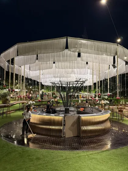 The circular bar being prepped for an event, with its beautiful white fabric canopy.