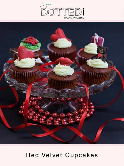 A platter of delicious red velvet cupcakes with custom Valentine's Day toppers. These sweet treats are a perfect edible gift for any special occasion.