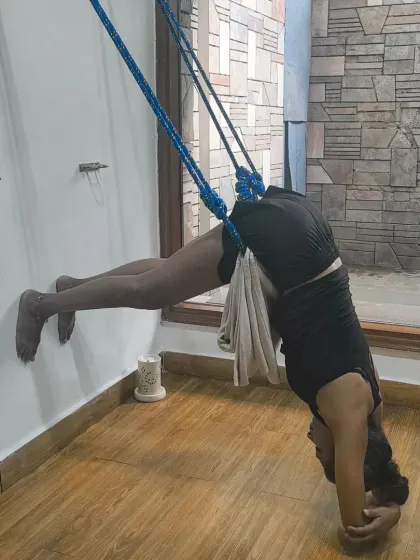 Total surrender in a supported headstand variation using the yoga wall. The ropes help to decompress the spine and allow for a deeper release, which feels wonderful midweek.