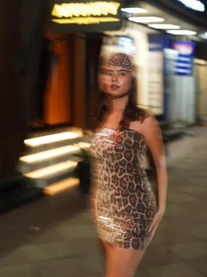 Another motion blur shot, creating an artistic and dynamic feel that makes the image stand out from typical street style photos.