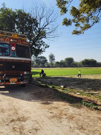A truck parked at our farm, ready for loading. We serve clients across India with our high-quality turf.