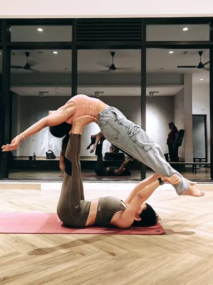 Another beautiful acro yoga pose that requires balance and trust. The flyer is in a supported backbend, creating a feeling of openness and surrender, while the base remains strong and steady.