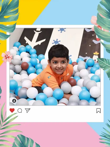A candid moment of pure happiness. Our ball pit is a colorful paradise where kids can just be kids.