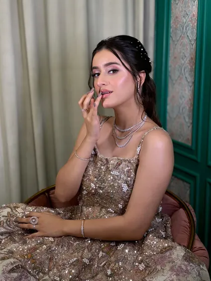 A playful and charming shot of the model, showing how comfortable and light the makeup feels.