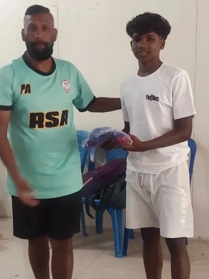 Another player receiving his kit, ready for the senior division debut.