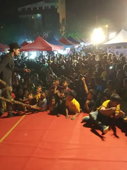 This photo captures the dynamic energy of a live performance for a large audience. You can see me interacting with volunteers on stage, a core part of my act to make the show personal and engaging for everyone.