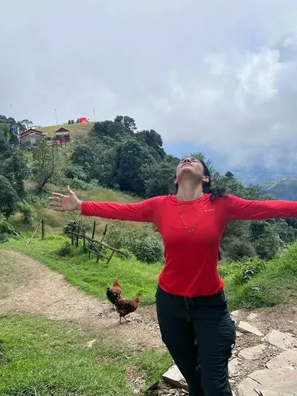 Embracing the vastness of the sky and mountains in Nepal. A moment of pure freedom and gratitude.