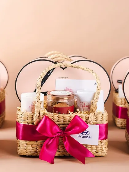 A lineup of the finished Hyundai Women's Day hampers. We ensure every basket in a bulk order is consistent in quality and presentation.