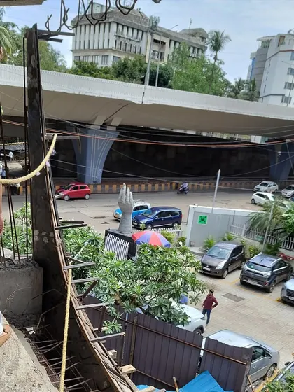 On-site at the BKC project, checking the alignment and position for the balcony moulds against the backdrop of the city.