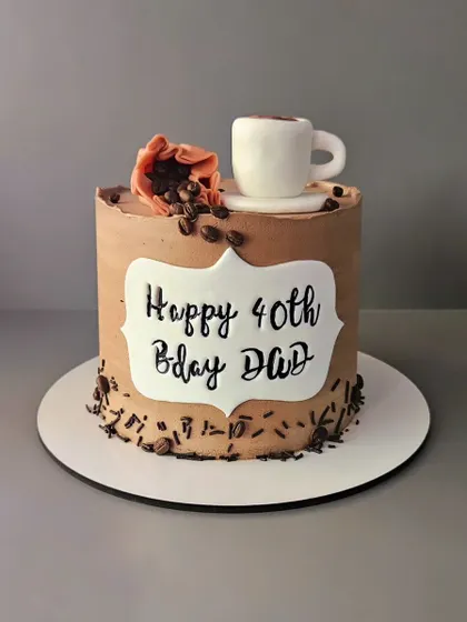 What's brewing? A chocolate buttercream cake for a coffee lover's 40th birthday, decorated with an edible coffee cup and beans.