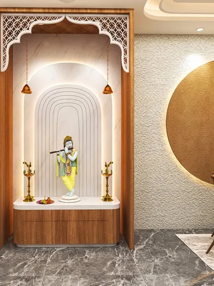 A pooja room is a space for peace and reflection. I designed this modern mandir with an elegant arch, intricate jali work, and soft backlighting to create a divine focal point that is both beautiful and spiritually calming.