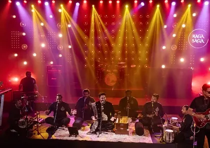 The 'Raga Saga' stage, inspired by Coke Studio, featuring a full ensemble of musicians and dynamic, concert-style lighting for an immersive live music experience.
