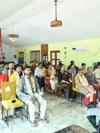 Participants listening intently during a Satsang session in Puri.