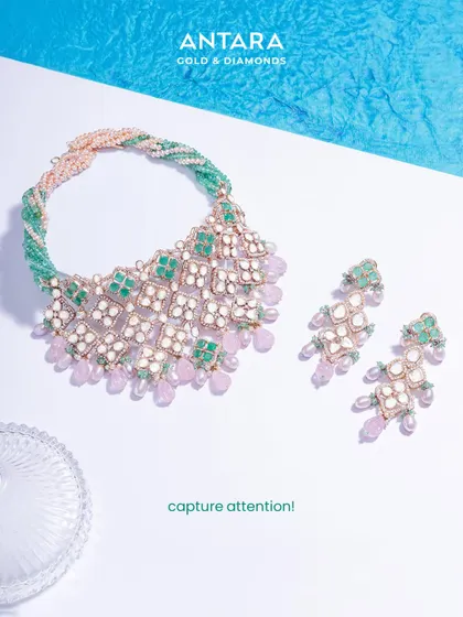 An exclusive piece of artistry designed to capture attention. This polki and gemstone set, with its twisted multi-strand band of green and pink beads, is a testament to unmatched elegance.