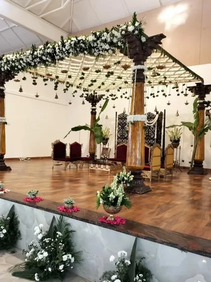 This shot captures the scale and grandeur of the traditional mandap, a testament to our team's dedication to creating awe-inspiring structures for your most important day.