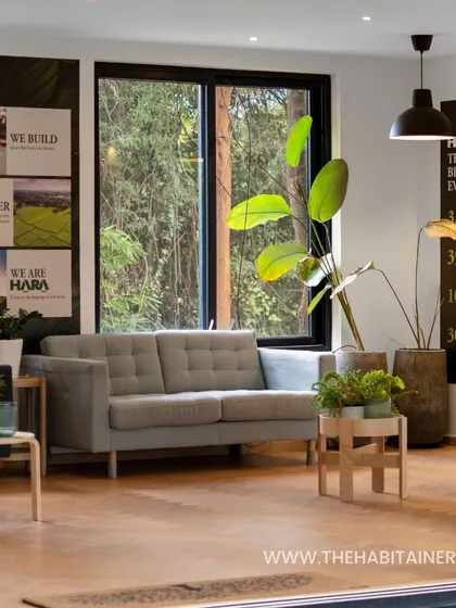 Looking into the HARA office from the outside, this view highlights the connection between the interior lounge and the green surroundings. It showcases how we design workspaces that feel open and inspiring.