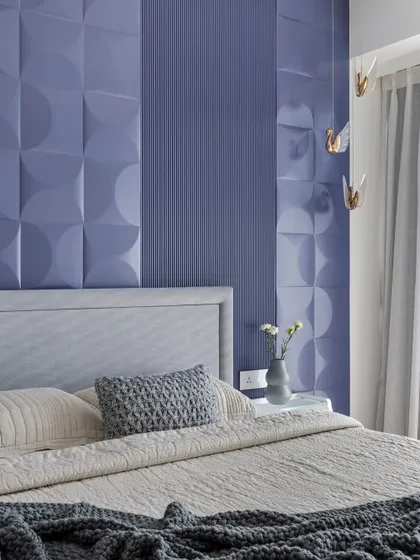 A full view of the lavender bedroom, highlighting the contrast between the bold purple wall and the minimalist grey and white elements.