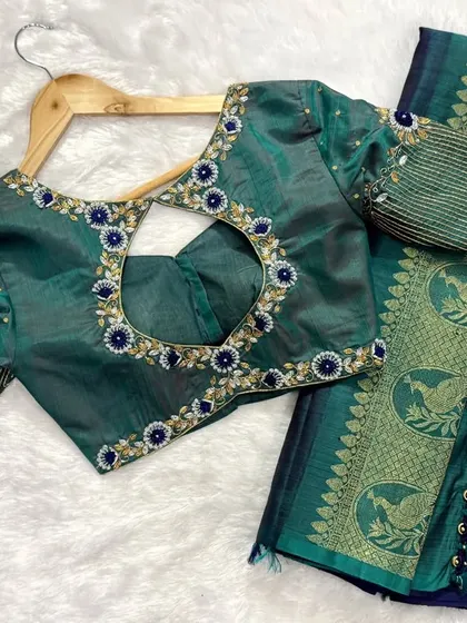 Elegance in every stitch. This beautifully customized blouse adds a touch of charm to any saree look.