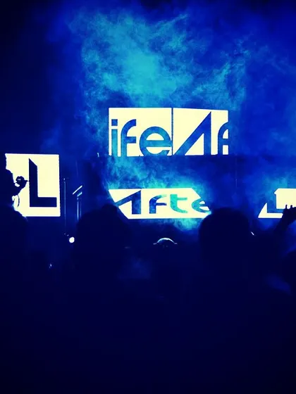 The classic AfterLife stage setup. Our logo is lit up as we command the stage, surrounded by the energy of the crowd.