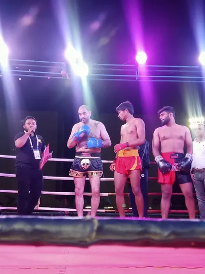 The pro fighters being introduced in the ring before the championship bouts begin.