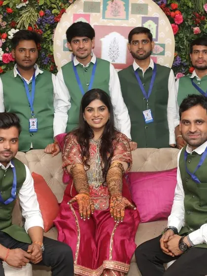 A group photo with a happy bride and my dedicated team. We work together to make sure the bride's vision comes to life and all her guests are taken care of.