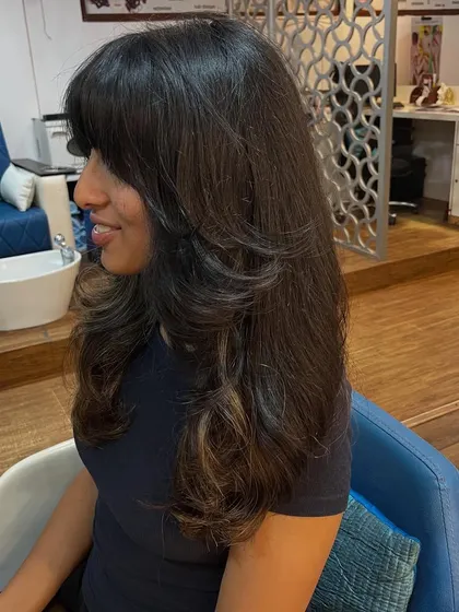 A side view of the long layered haircut.