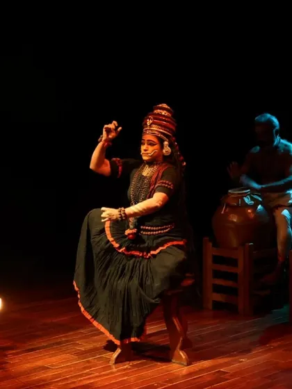A captivating moment from "Shaiva Koothu," a Nangiar Koothu performance by Kapila Venu. This ancient solo storytelling tradition was adapted for the first time to tell the story of the Tamizh saint Thiru Karaikkal Ammaiyar.
